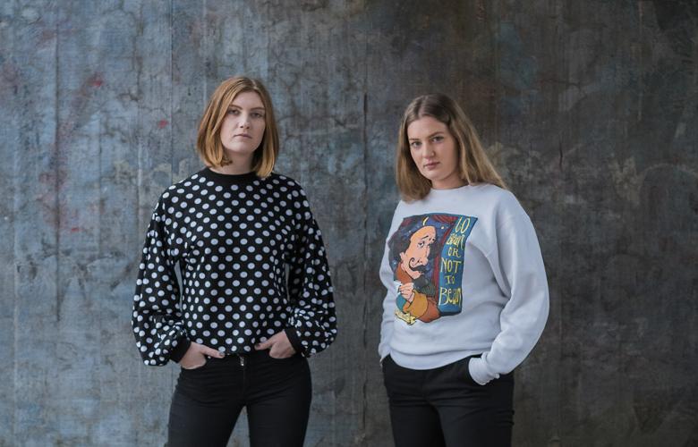 Image: Two young women with a serious expression on their faces
